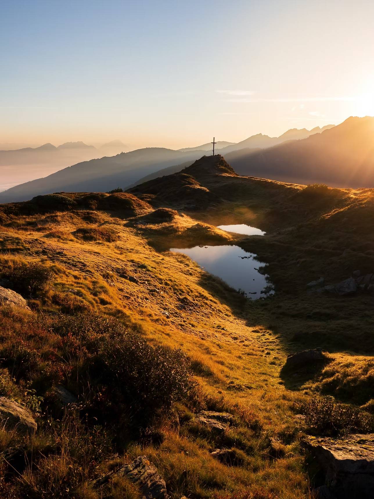 Summer – mountain peaks and alpine lakes at sunrise